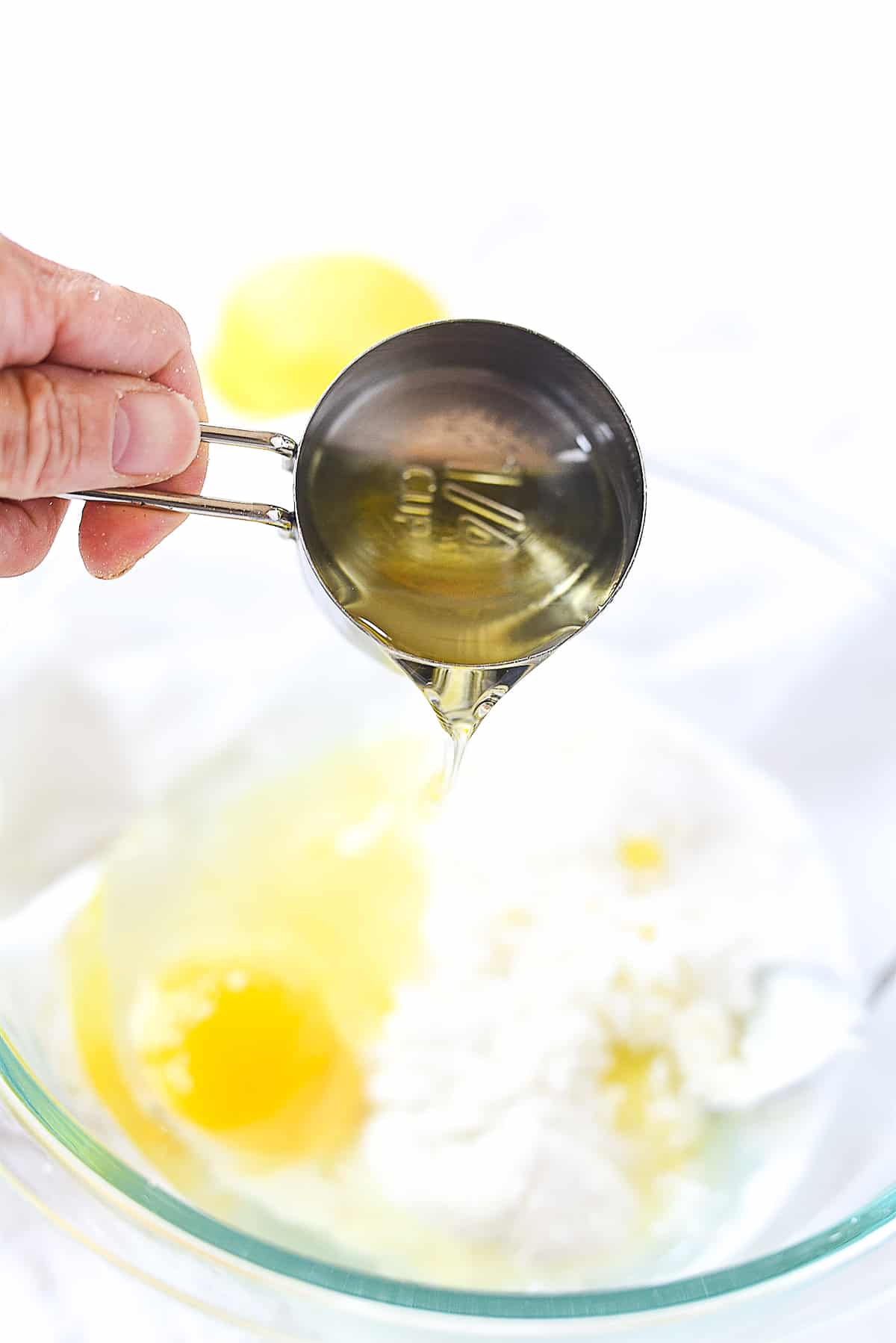 pouring oil into batter