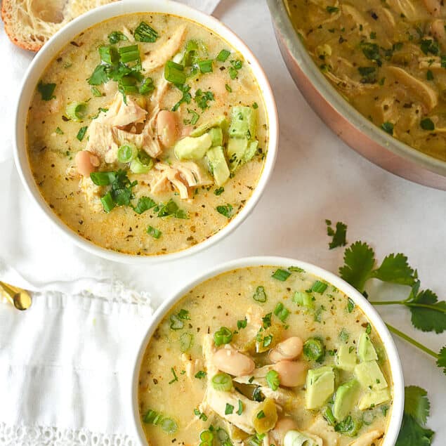 overhead shot of two bowls of white chicken chili