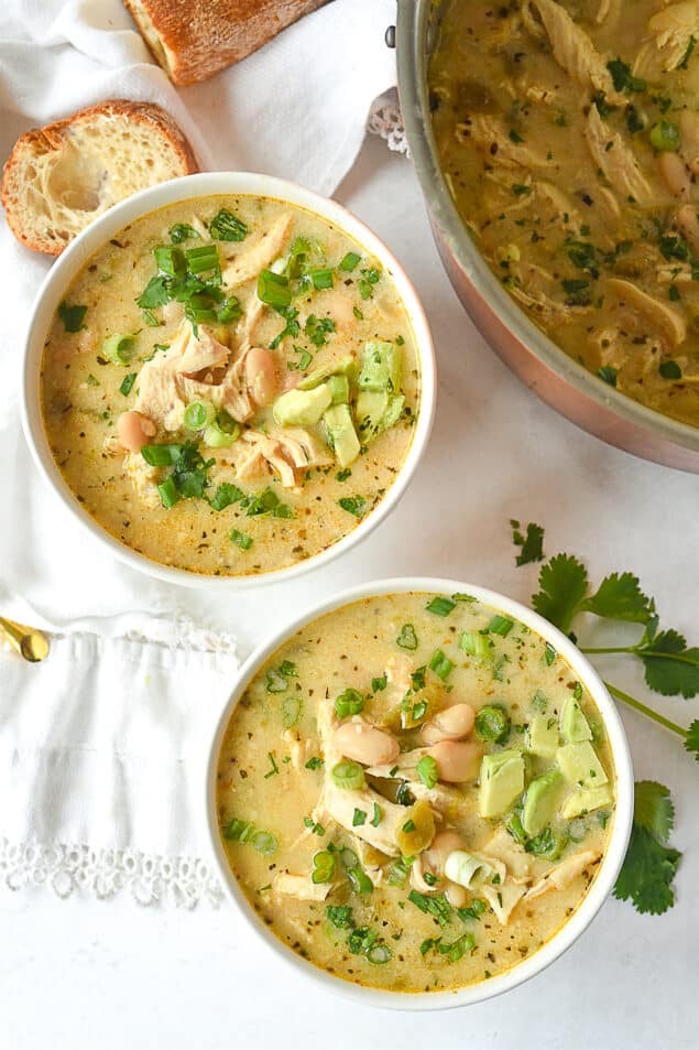 overhead shot of two bowls of white chicken chili