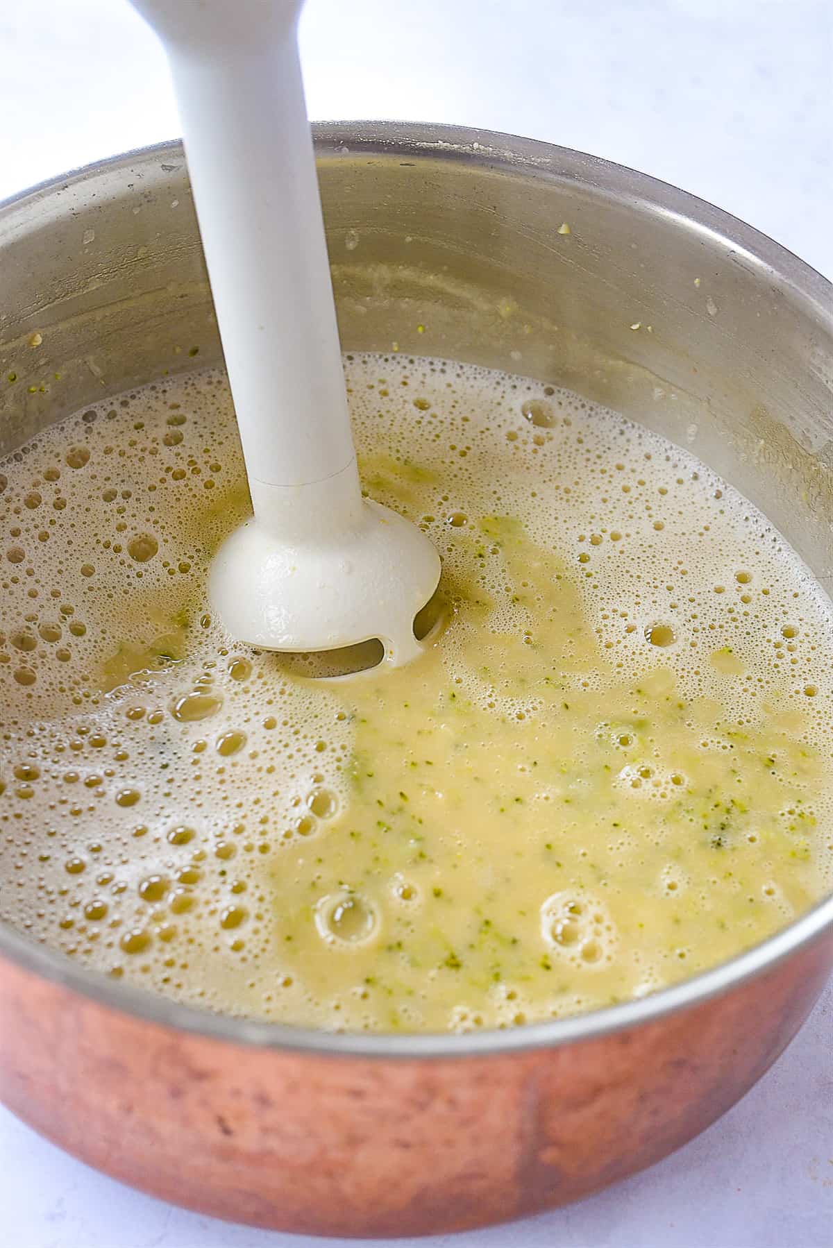 immersion blender in a pot of soup