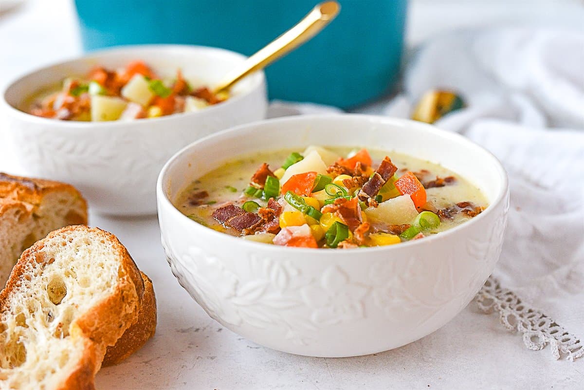 white bowls of corn chowder