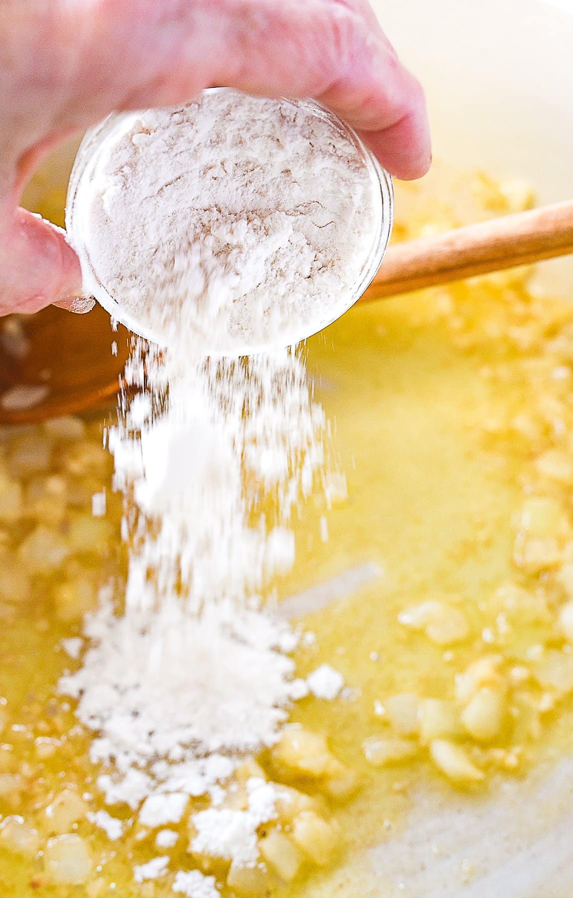 adding flour to corn chowder