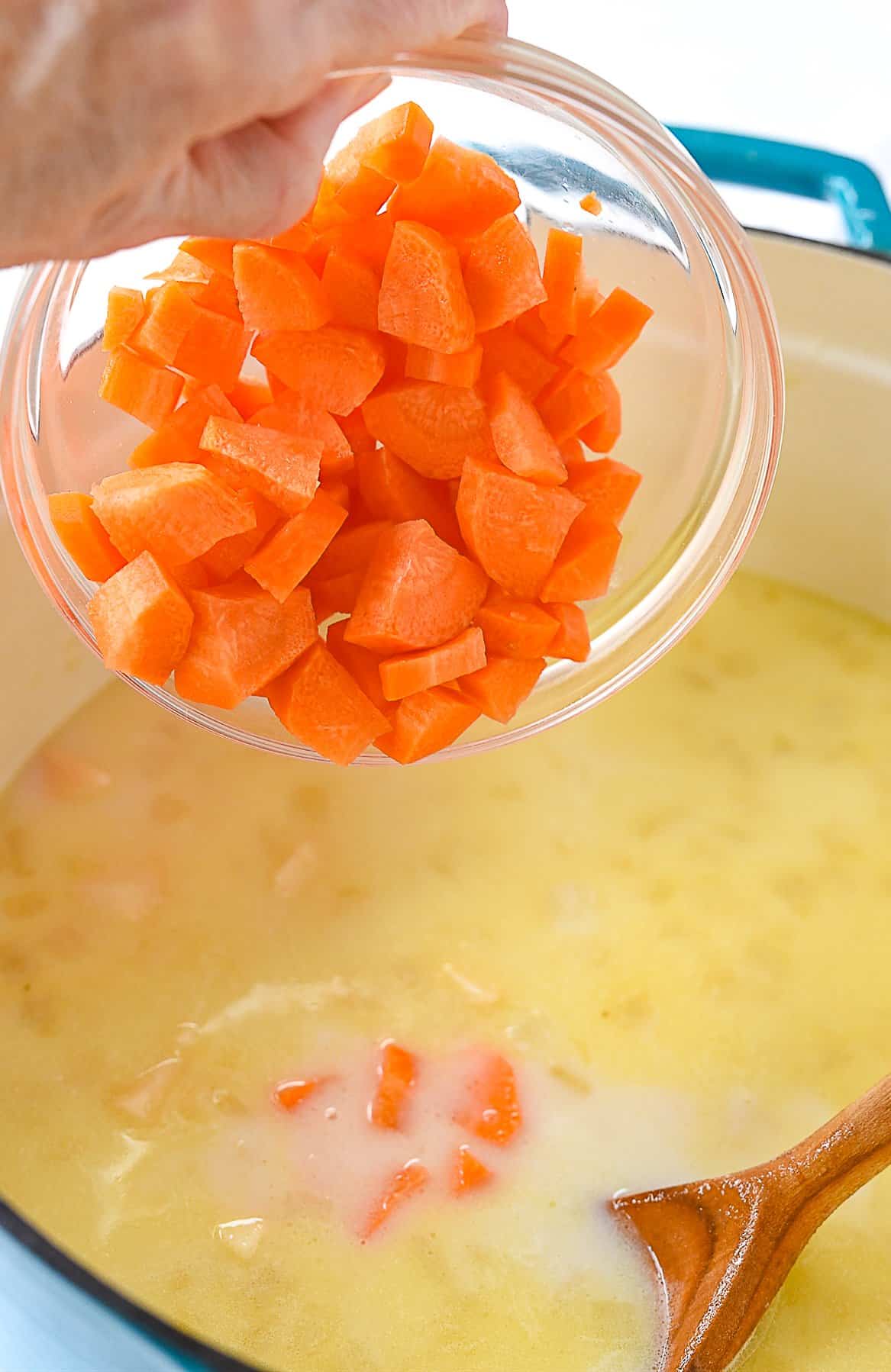 adding carrots to corn chowder