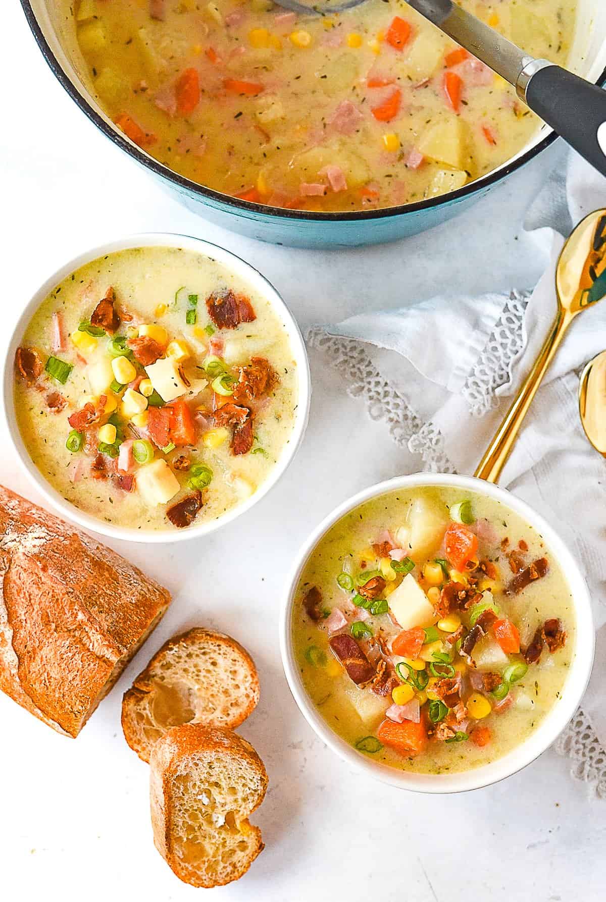 overhead shot of two bowls of corn chowder