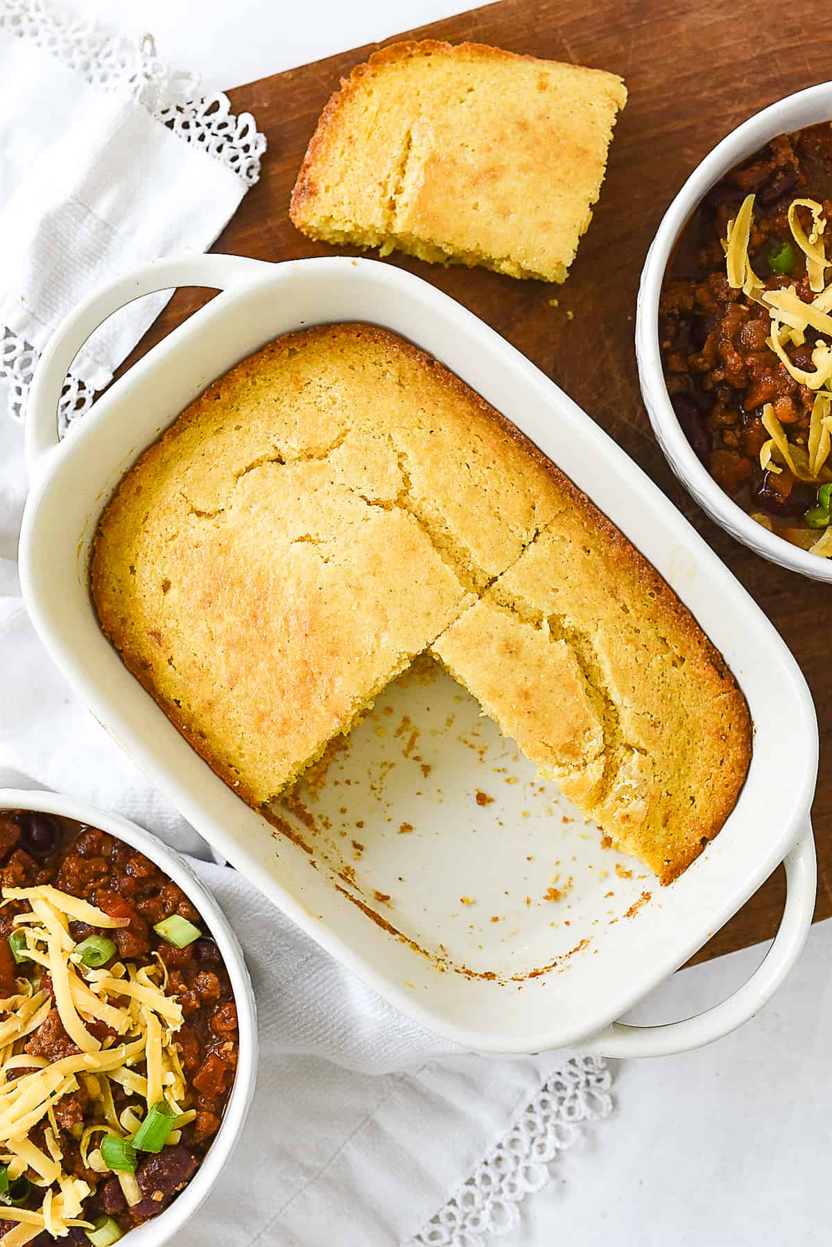 overhead shot of small batch cornbread with two bowls of chili