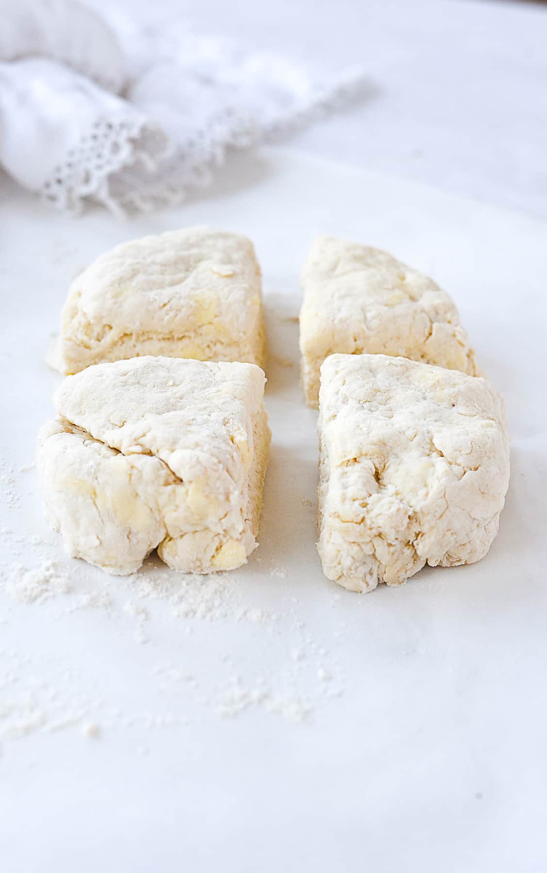 biscuit dough cut into four pieces