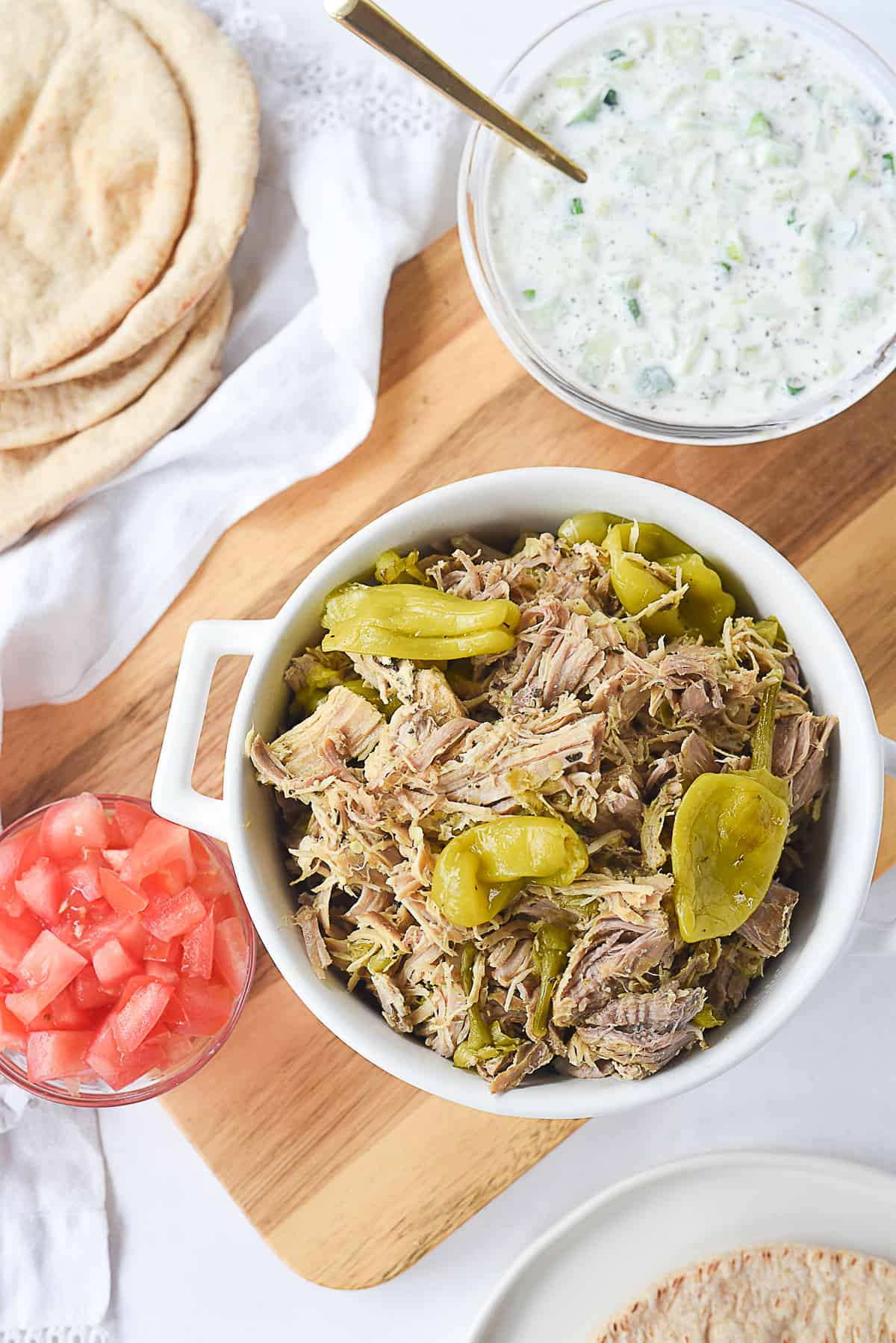 greek pork with cucumber sauce and tomato