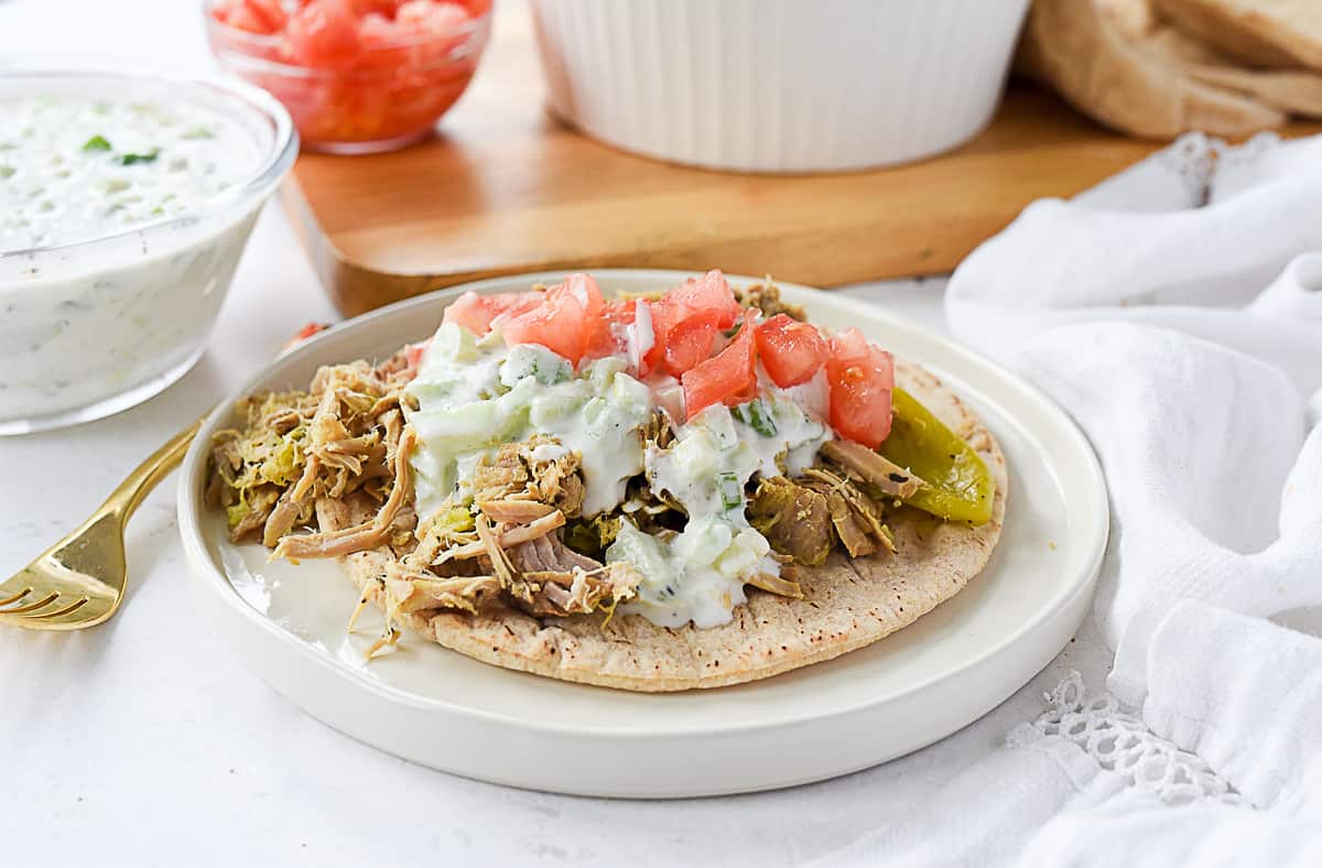 greek pork on pita on a plate