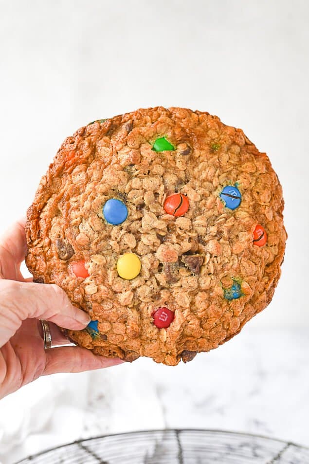 hand holding a giant monster cookie