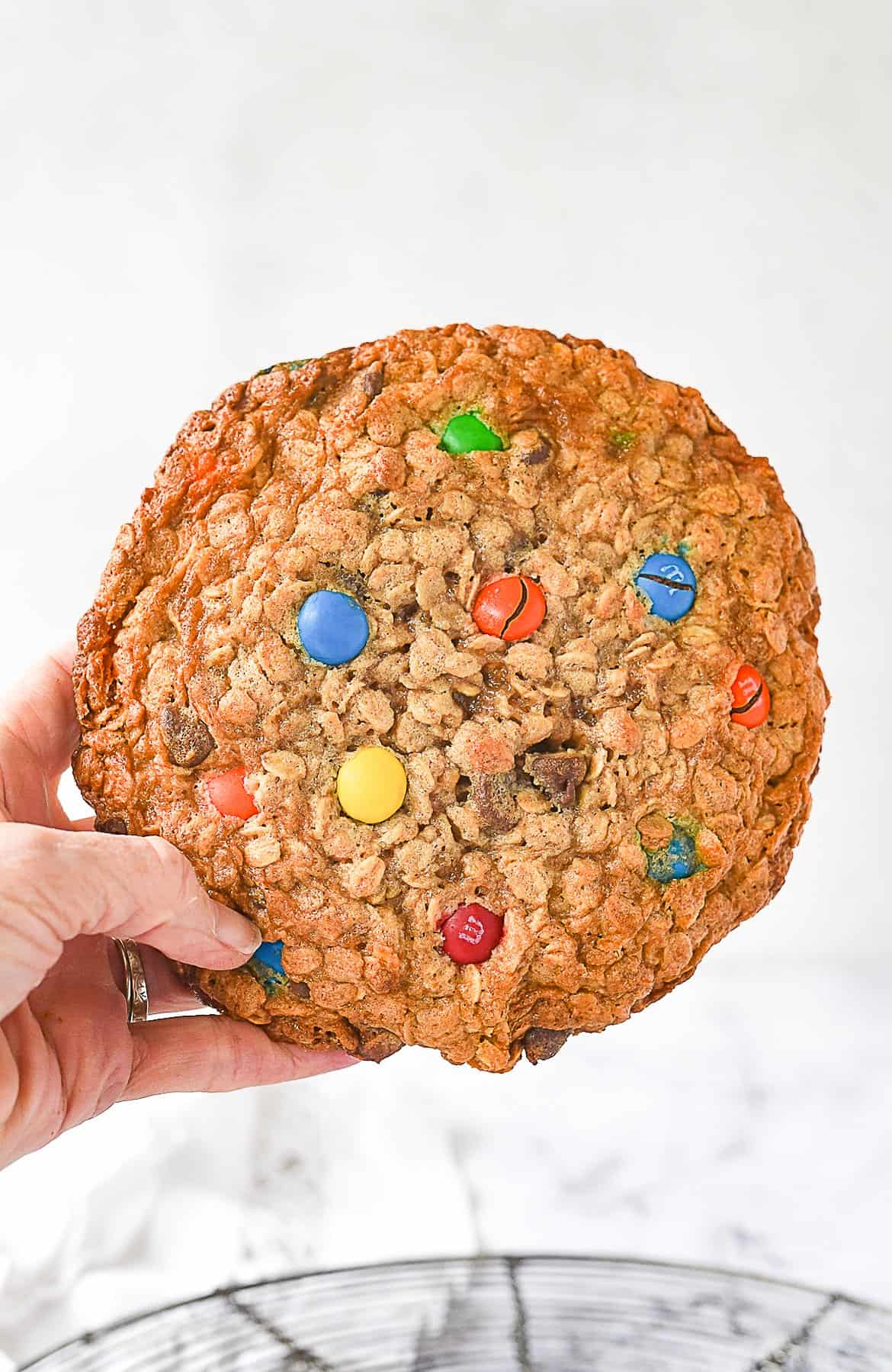 hand holding a giant monster cookie