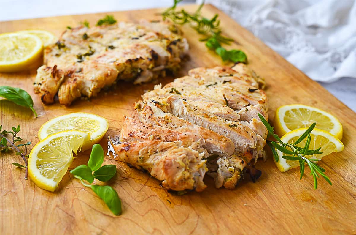 marinaded chicken on a cutting board