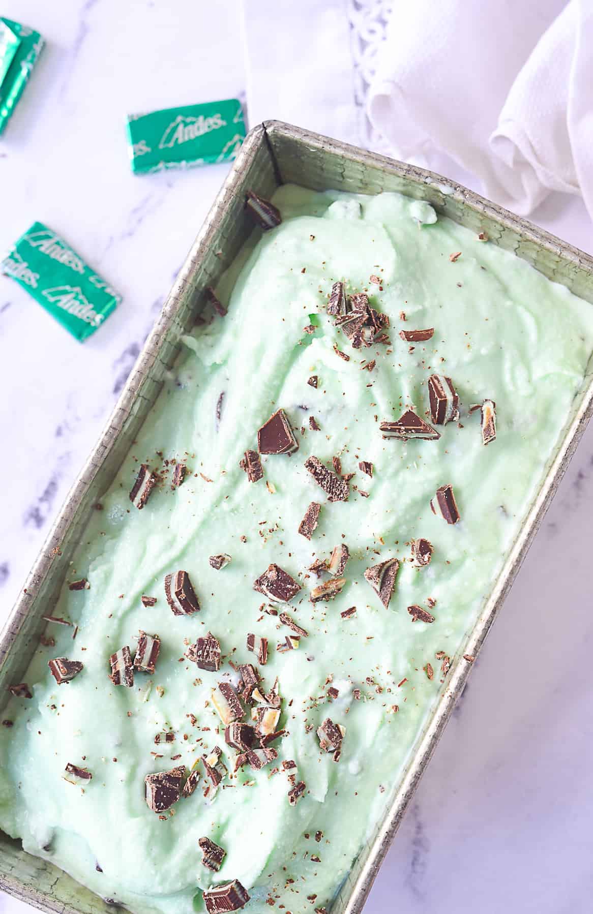 overhead shot of mint chocolate chip ice cream in a pan