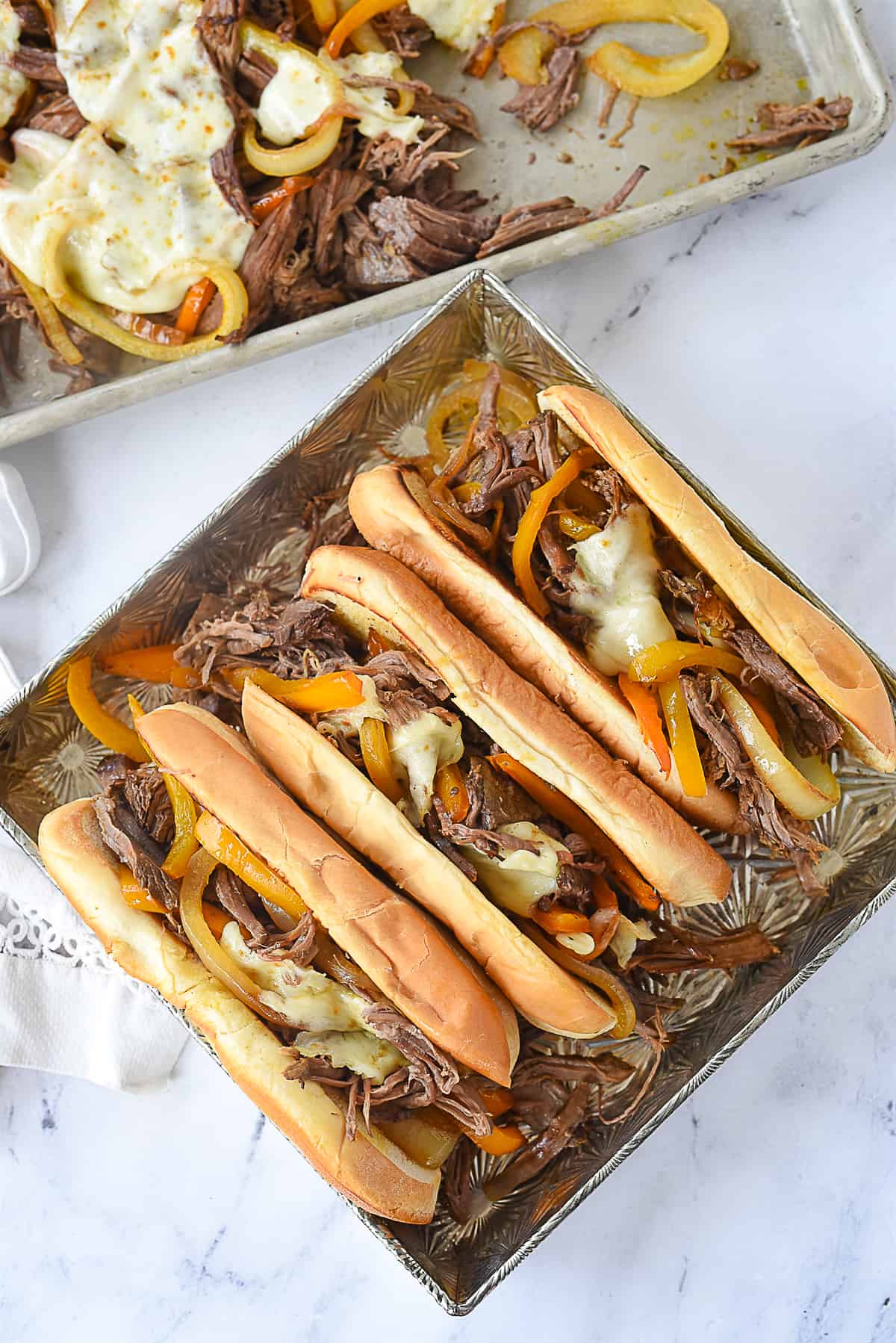 philly cheesteak sandwiches in a pan