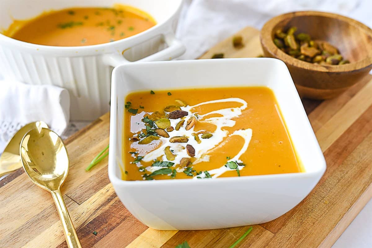 butternut squash soup in a white bowl