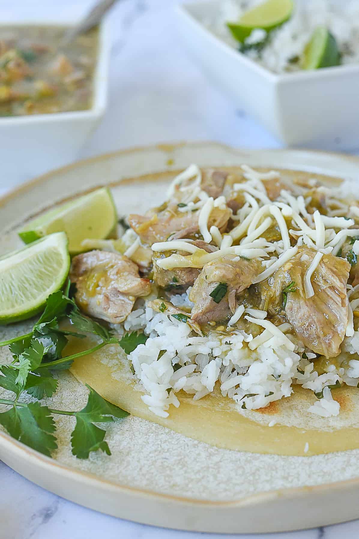 plate of slow cooker chile verde over rice