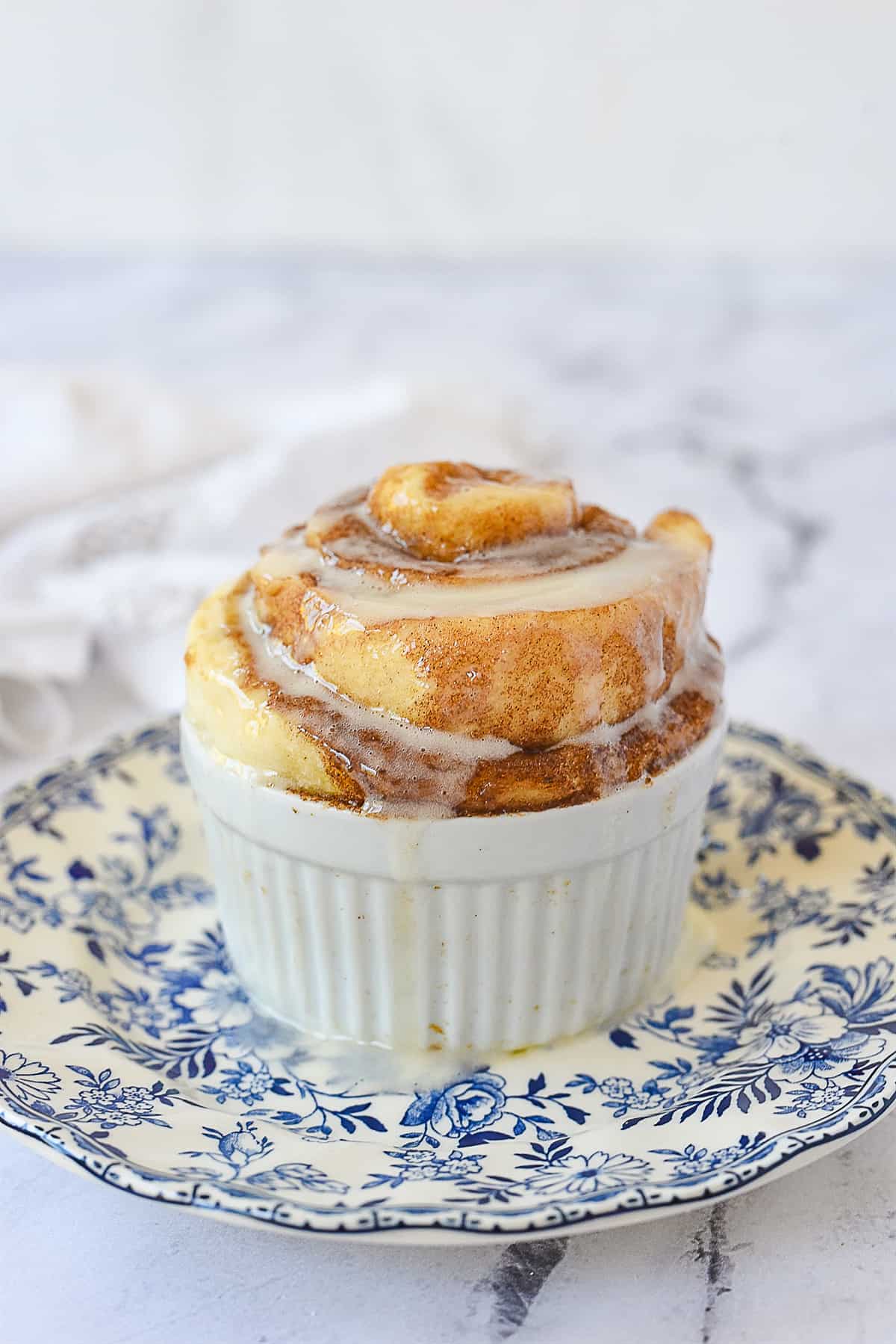 microwave cinnamon roll on a plate