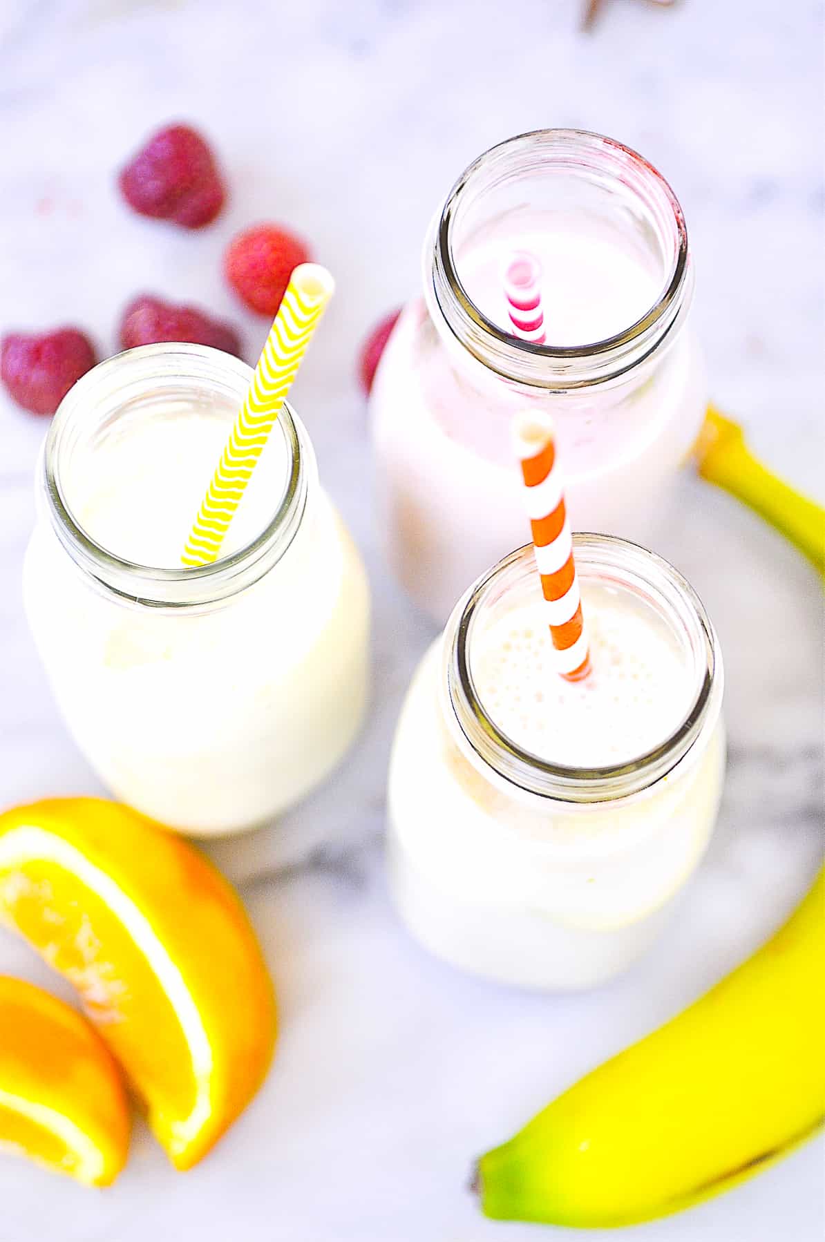 three bottles of fruit flavored milk