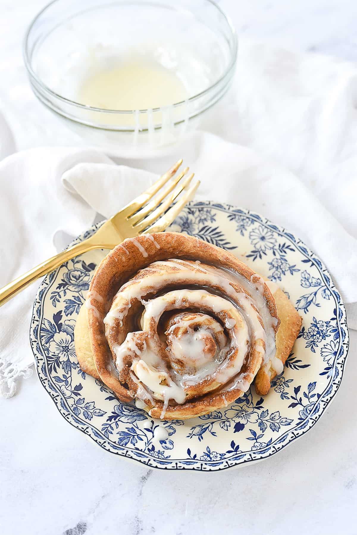 one cinnamon roll on a  plate