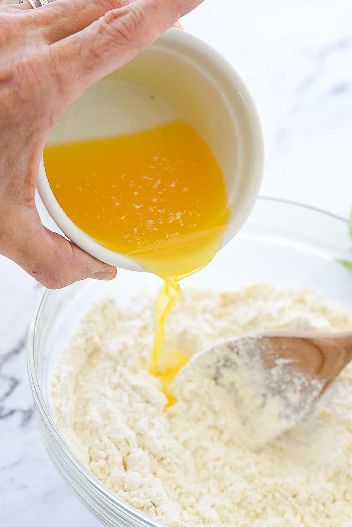 pouring butter into streusel topping