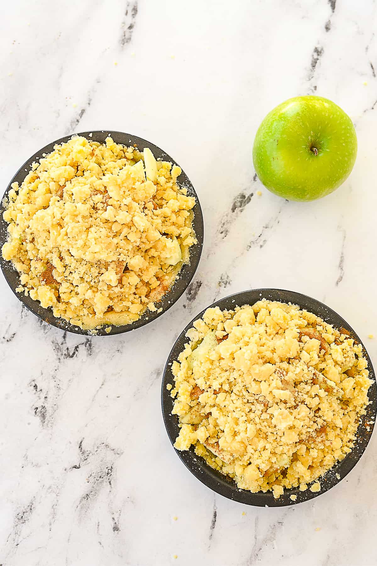 apple pies sprinkled with streusel topping