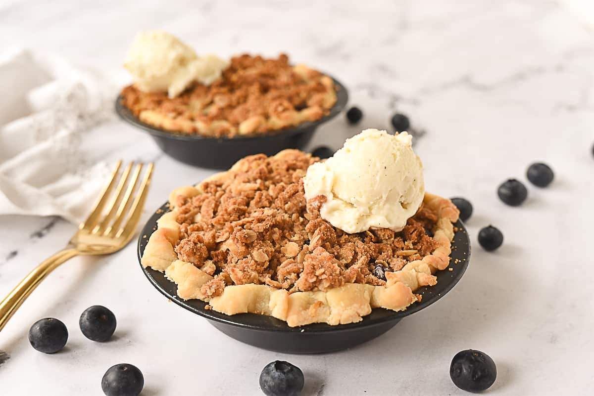 two mini blueberry pies