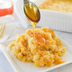 pouring honey over corn casserole