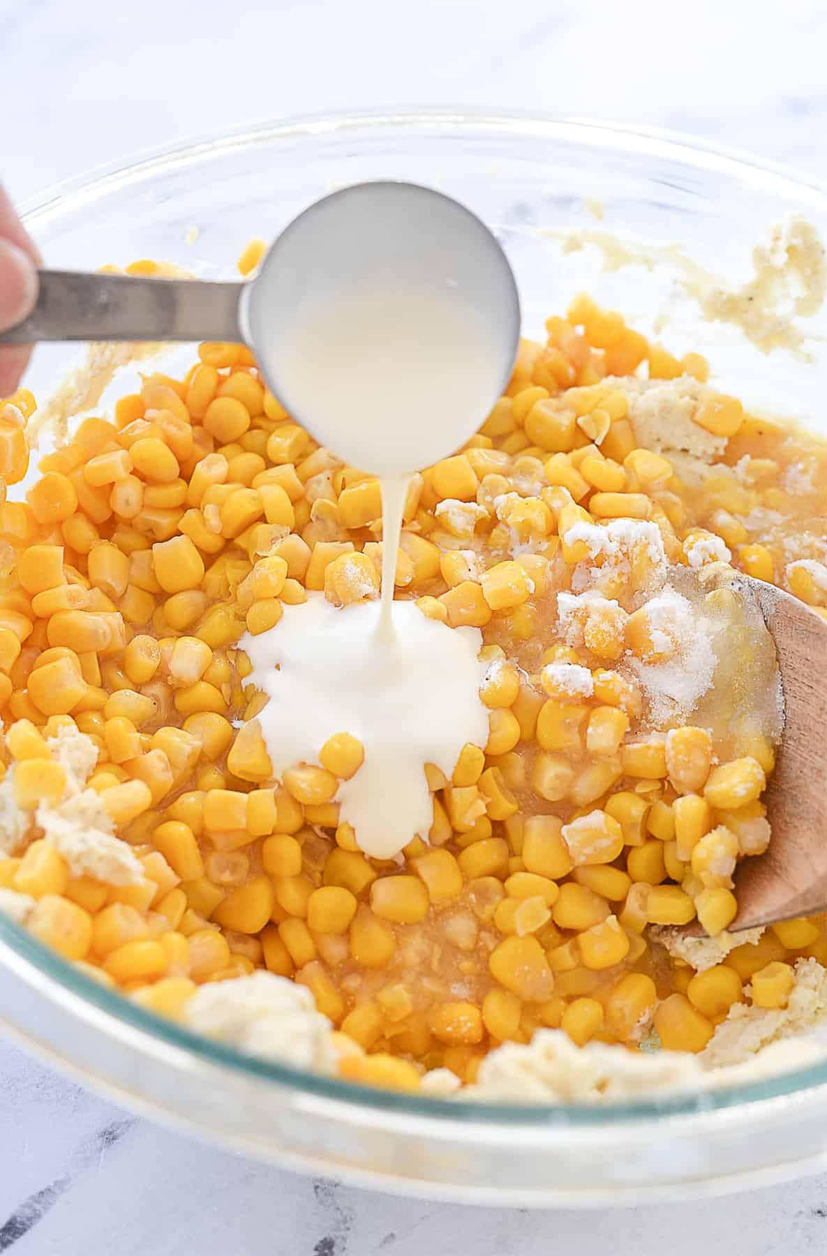 adding cream to corn mixture