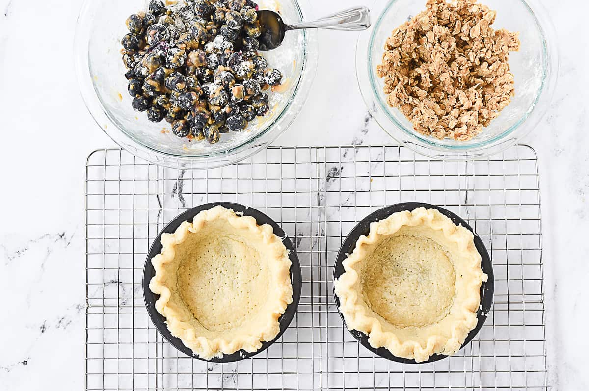 assembling blueberry pies