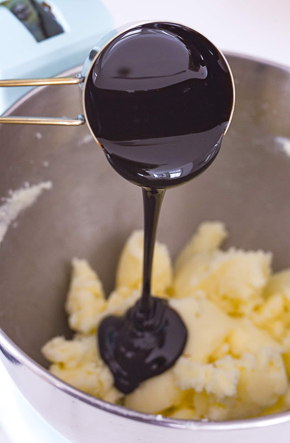pouring molasses into bowl