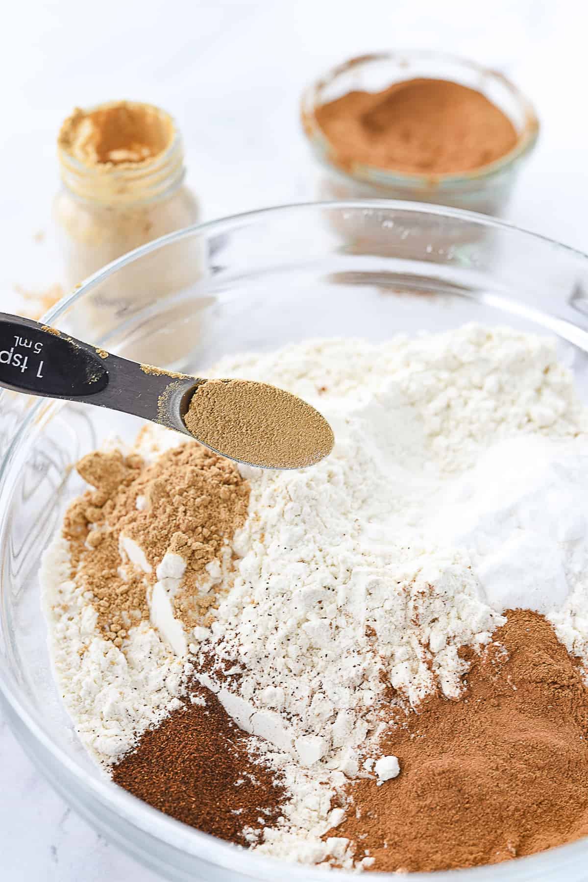 adding ginger into flour