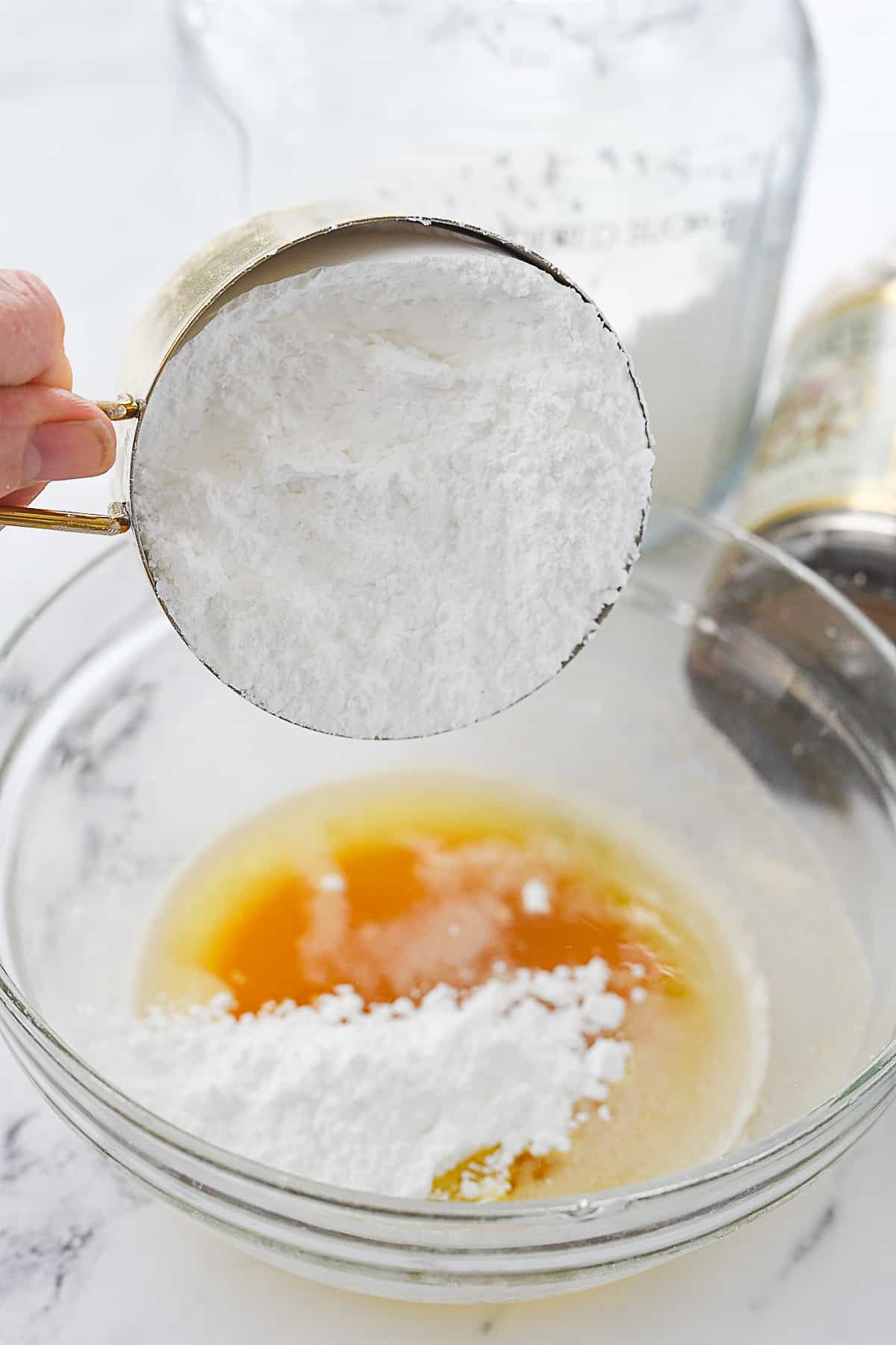 adding powdered sugar to brown butter