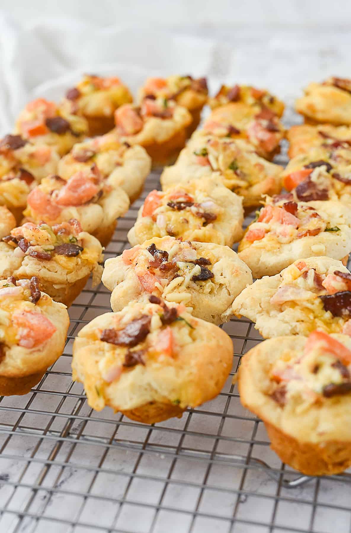 bacon tomato cups on a cooling rack