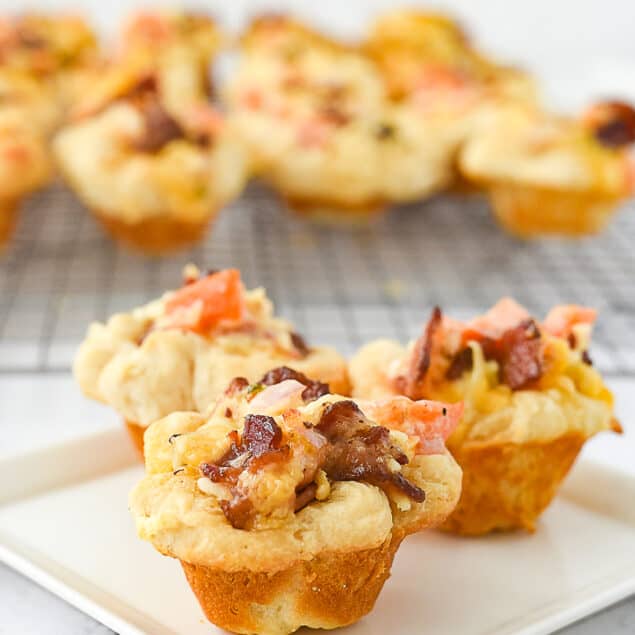 bacon tomato cups on a plate