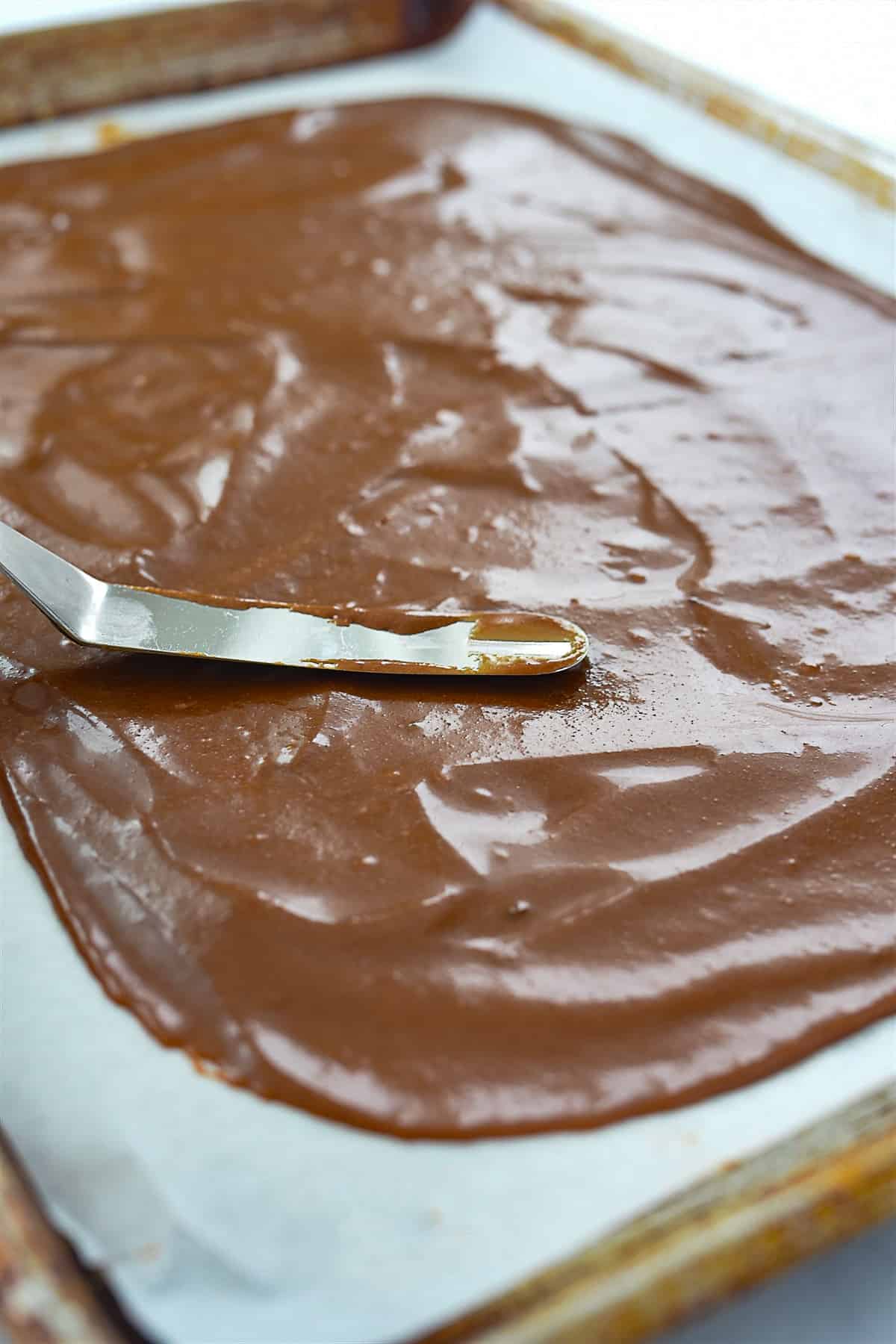 spreading batter on baking sheet