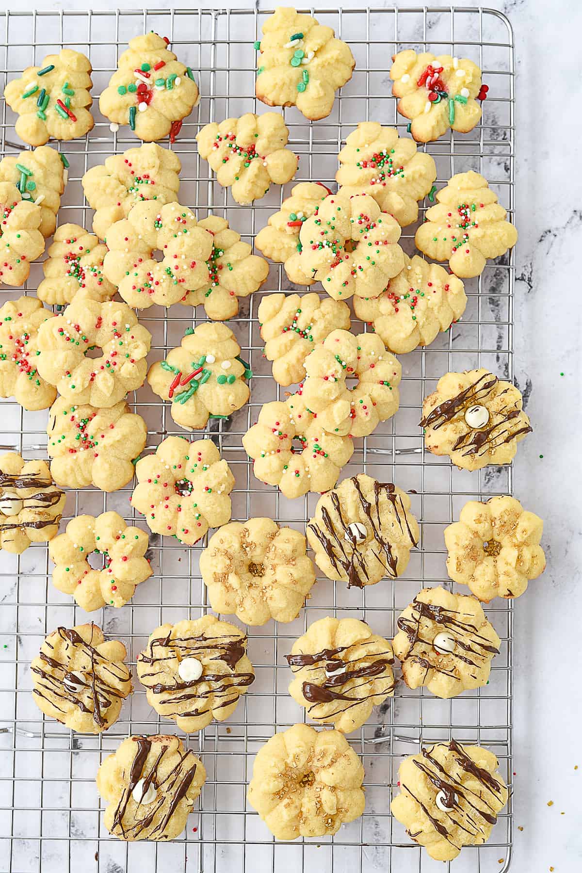 spritz cookies on a cooling rack