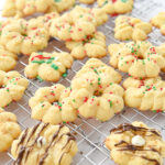 spritz cookies on a cooling rack