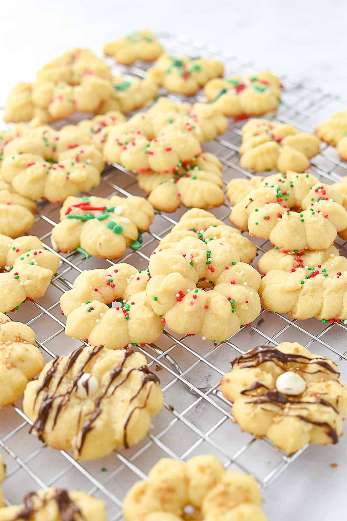 spritz cookies on a cooling rack