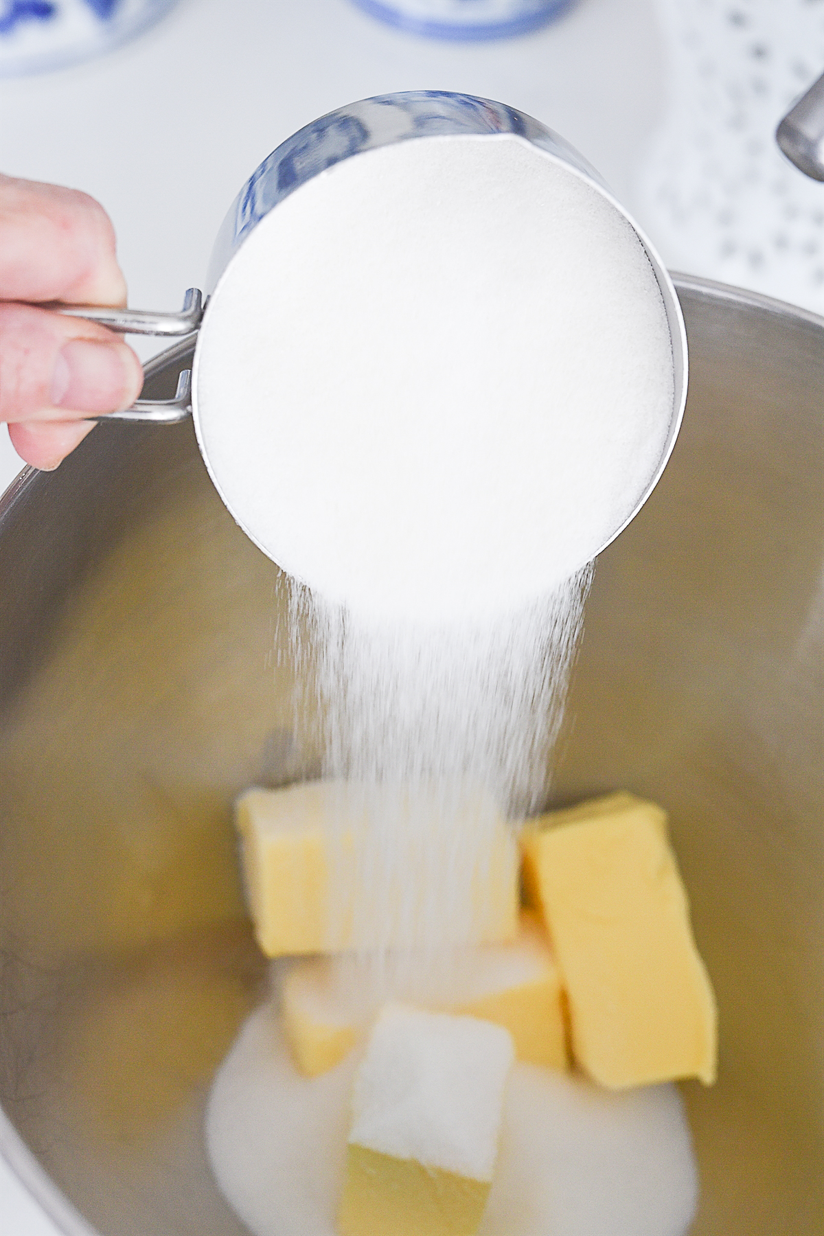 adding sugar to butter