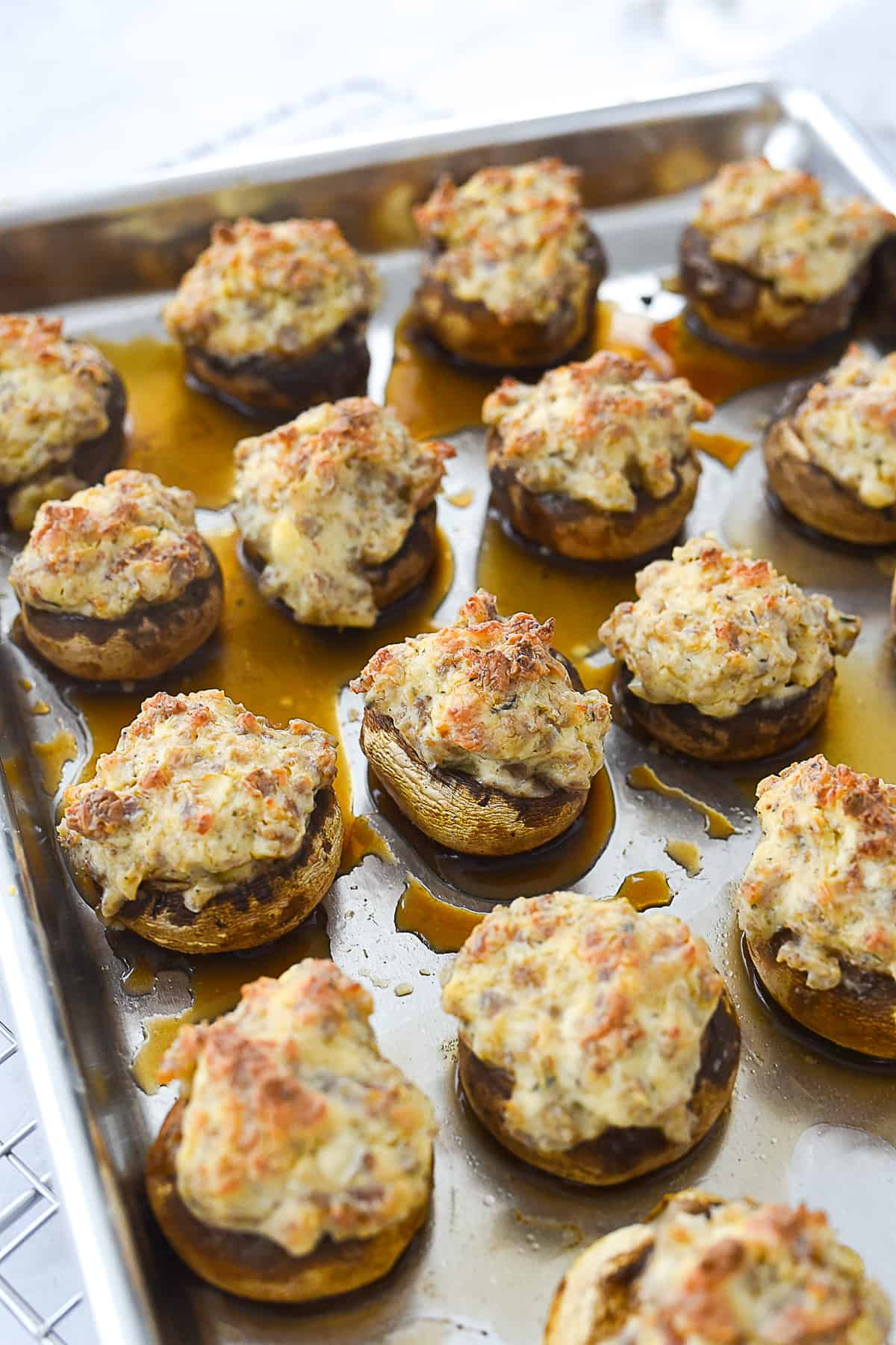 baked stuffed mushrooms on a baking sheet