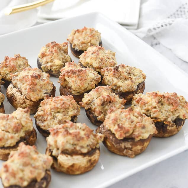 stuffed mushrooms on a white plate