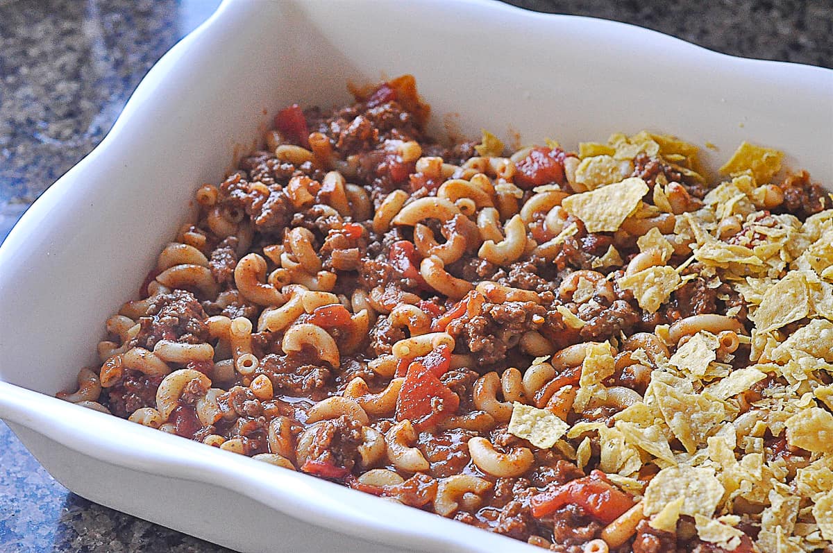 taco pasta bake being assemblied