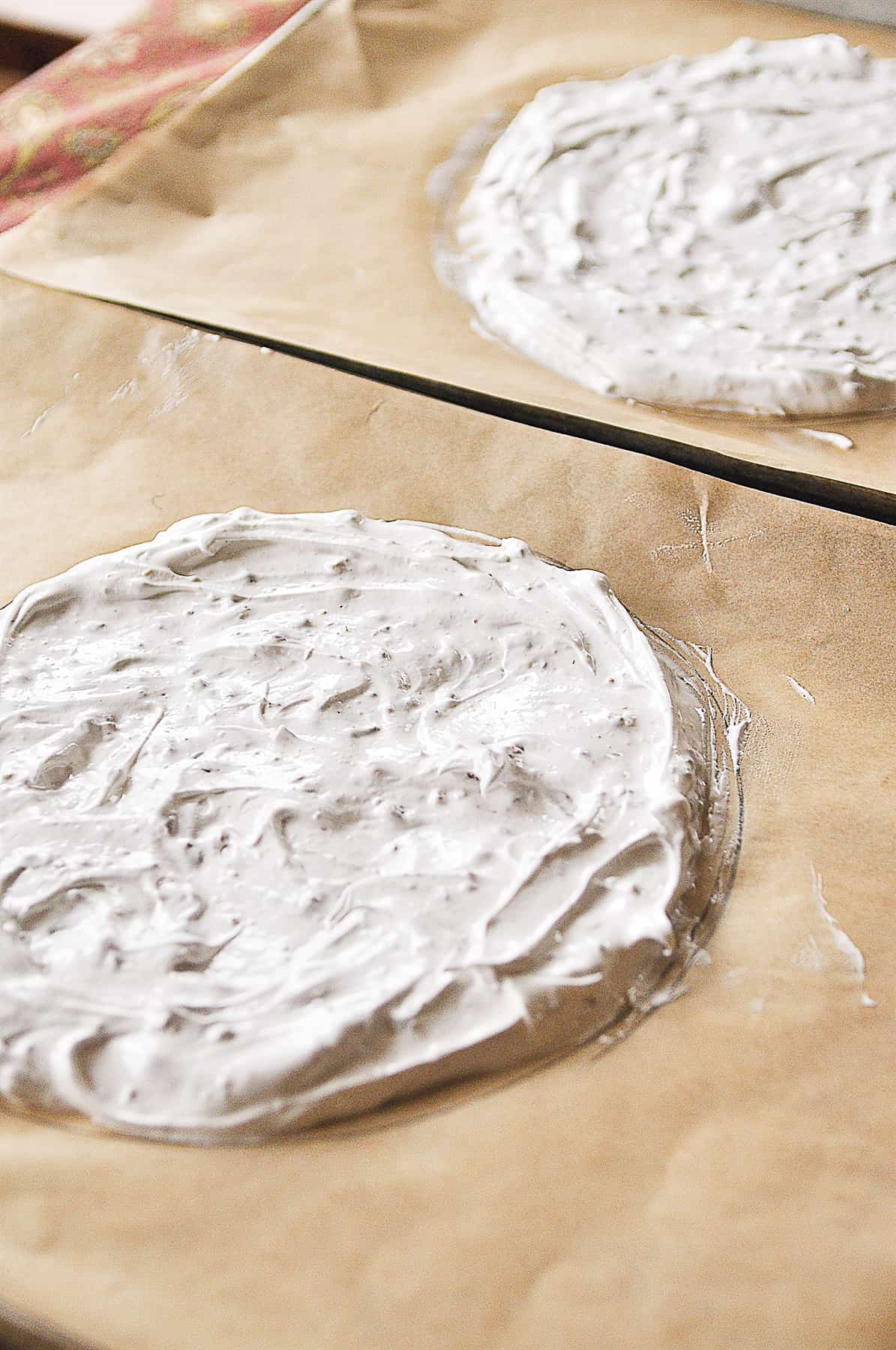 spreading meringue on brown paper