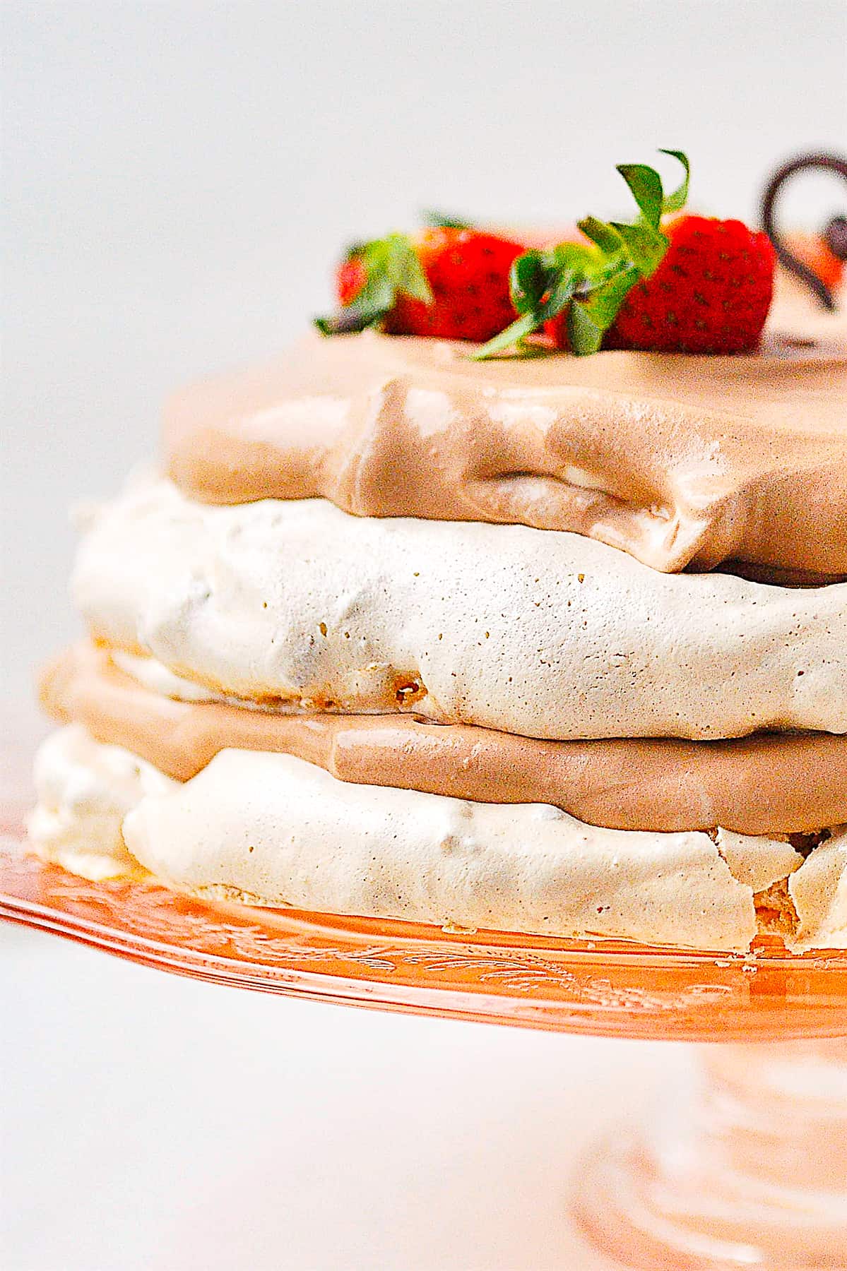 chocolate meringue cake on a cake stand