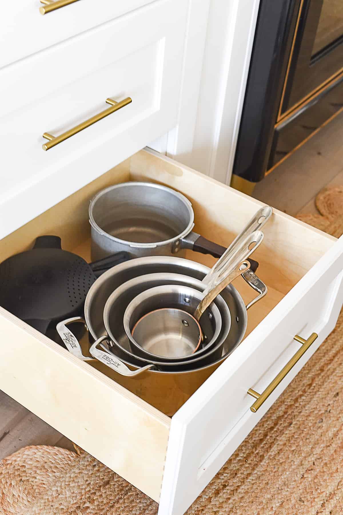 pots and pans in a drawer