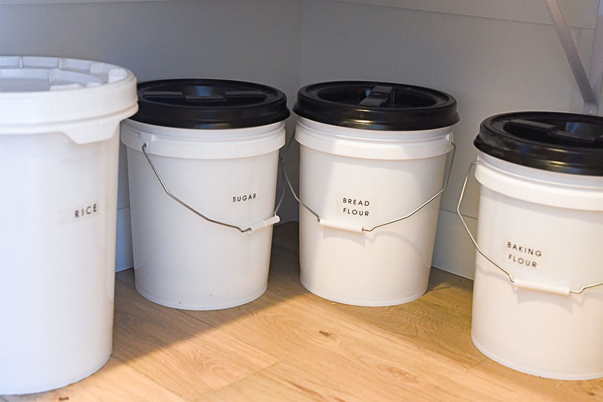 food buckets on pantry floor
