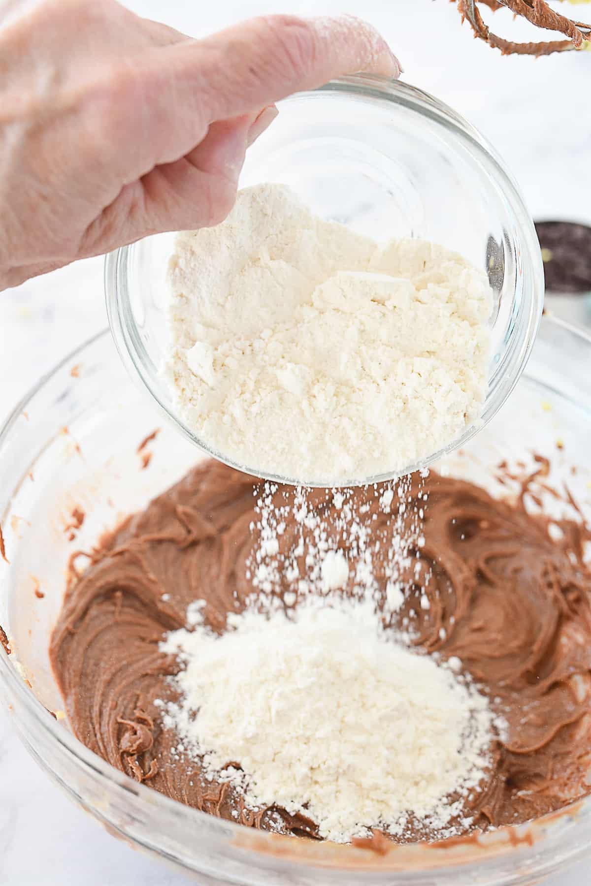 adding flour to nutella brownie batter