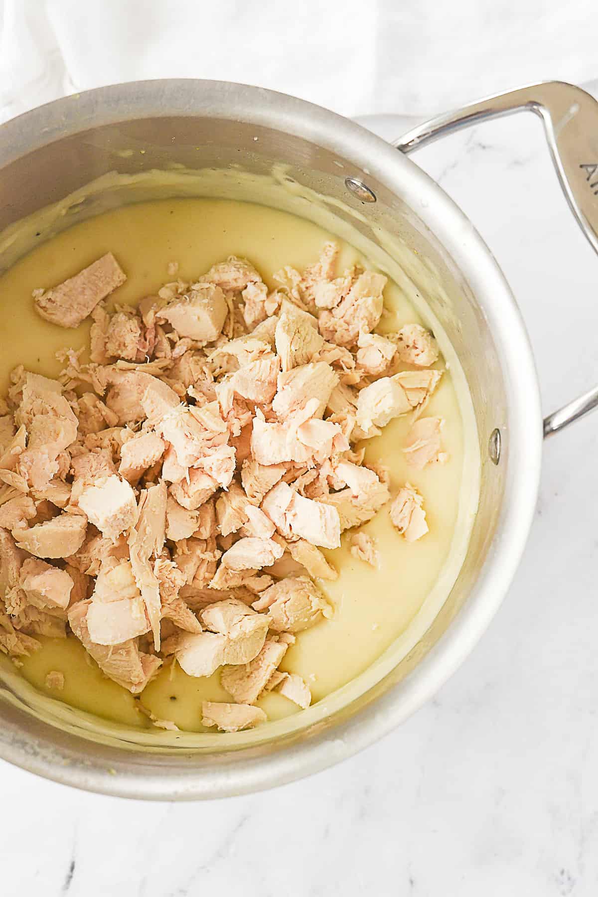 adding chicken into cream of chicken soup