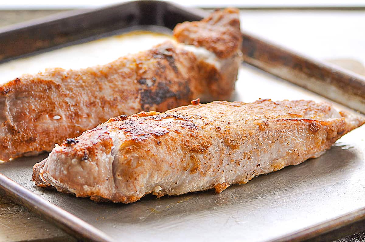 browned pork tenderloins on  a baking sheet