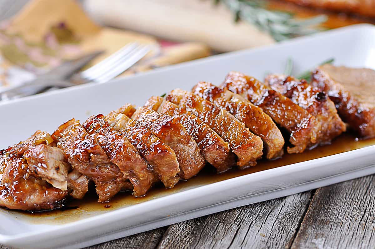 sliced pork tenderloin on a plate