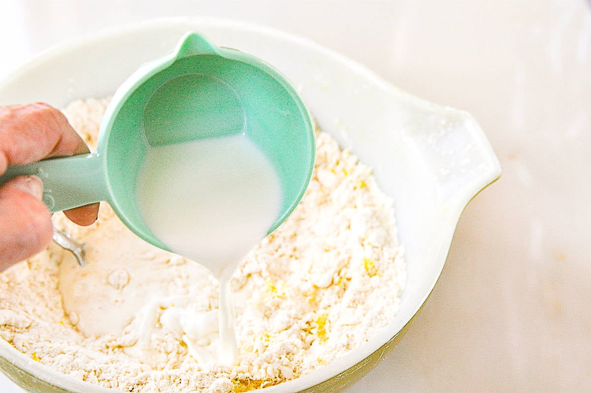 pouring milk in to scone mixture